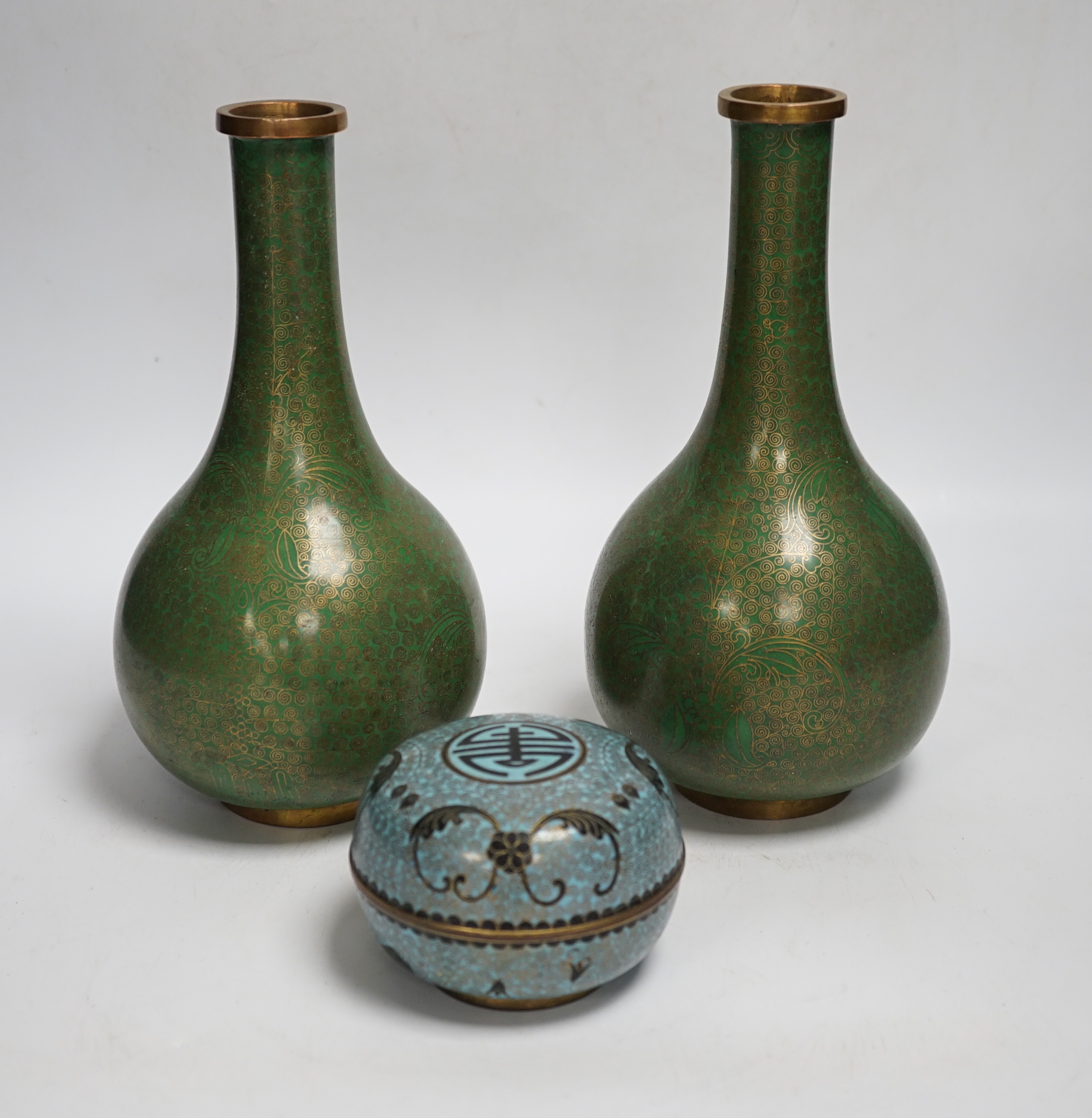 A pair of Chinese cloisonne enamel vases and a box and cover, tallest 23cm